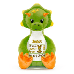 Dinosaurus bamse med navn og dato brodert på magen.