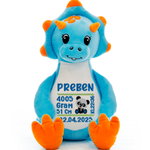 Dinosaurus bamse med navn og dato brodert på magen.
