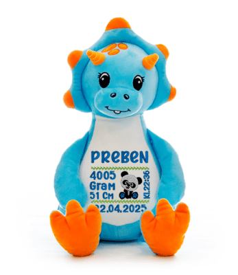 Dinosaurus bamse med navn og dato brodert på magen.